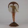 Le Soleil by Erte Art Deco bronze of a beautiful young woman in diaphanous dress wearing a spectacular headdress of circular form representing the sun - Hickmet Fine Arts