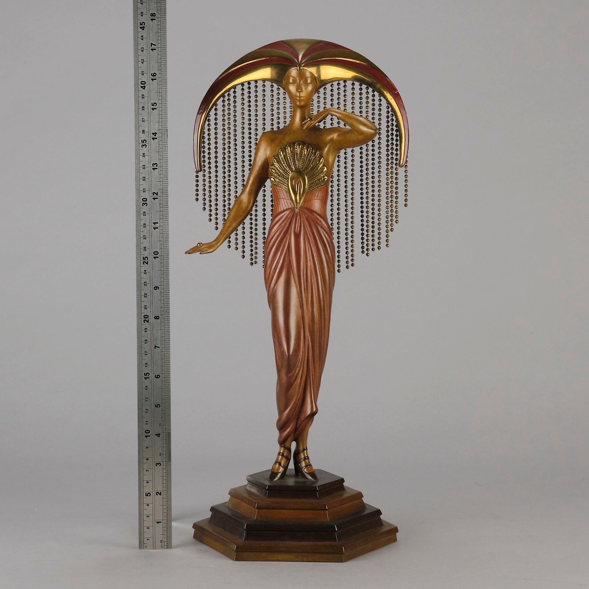 Le Soleil by Erte Art Deco bronze of a beautiful young woman in diaphanous dress wearing a spectacular headdress of circular form representing the sun - Hickmet Fine Arts