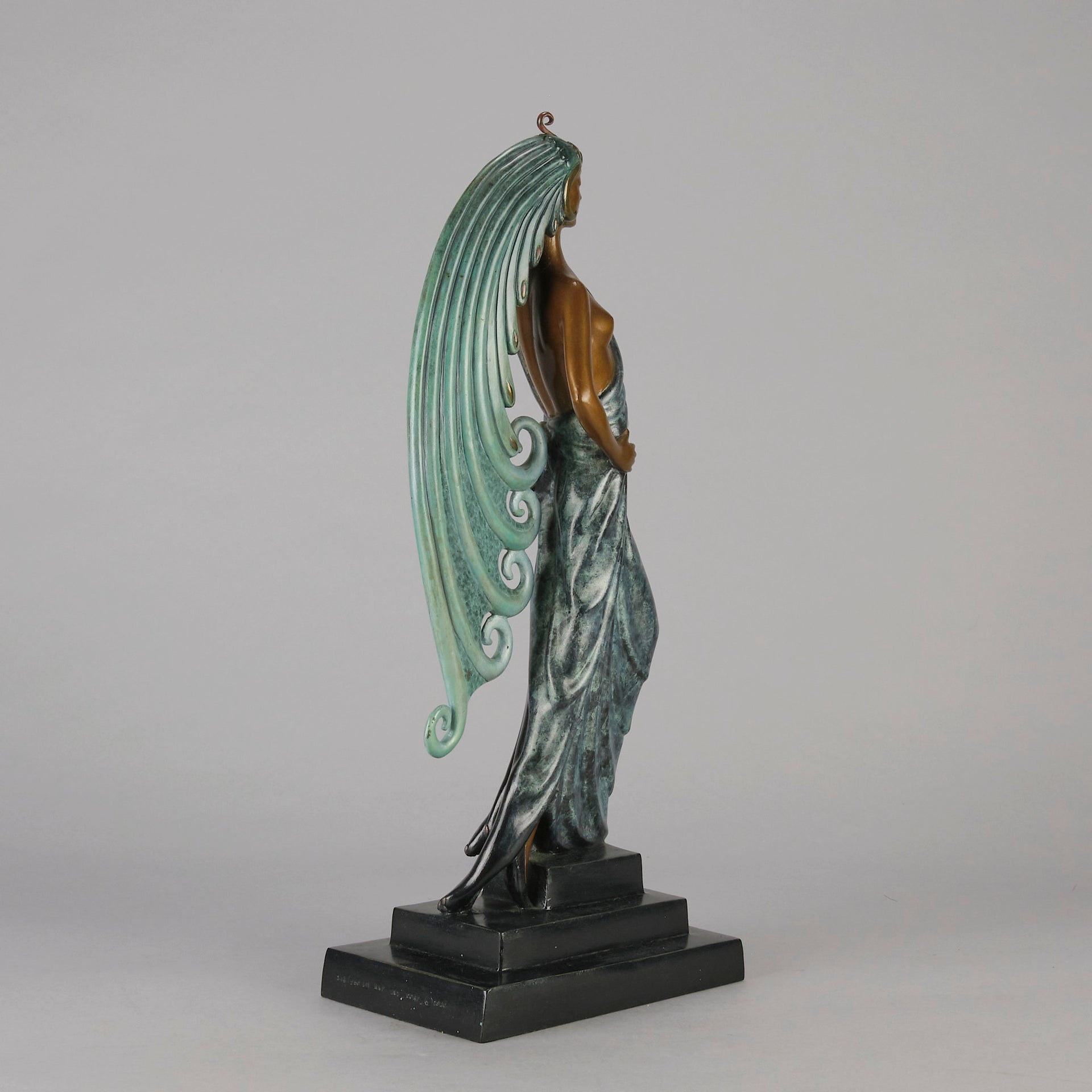  Beauty and the Beast by Erté a limited edition 20th Century bronze figure modelled as a beautiful young woman walking up a set of stairs wearing an impressive headdress and draped in a panther fur 