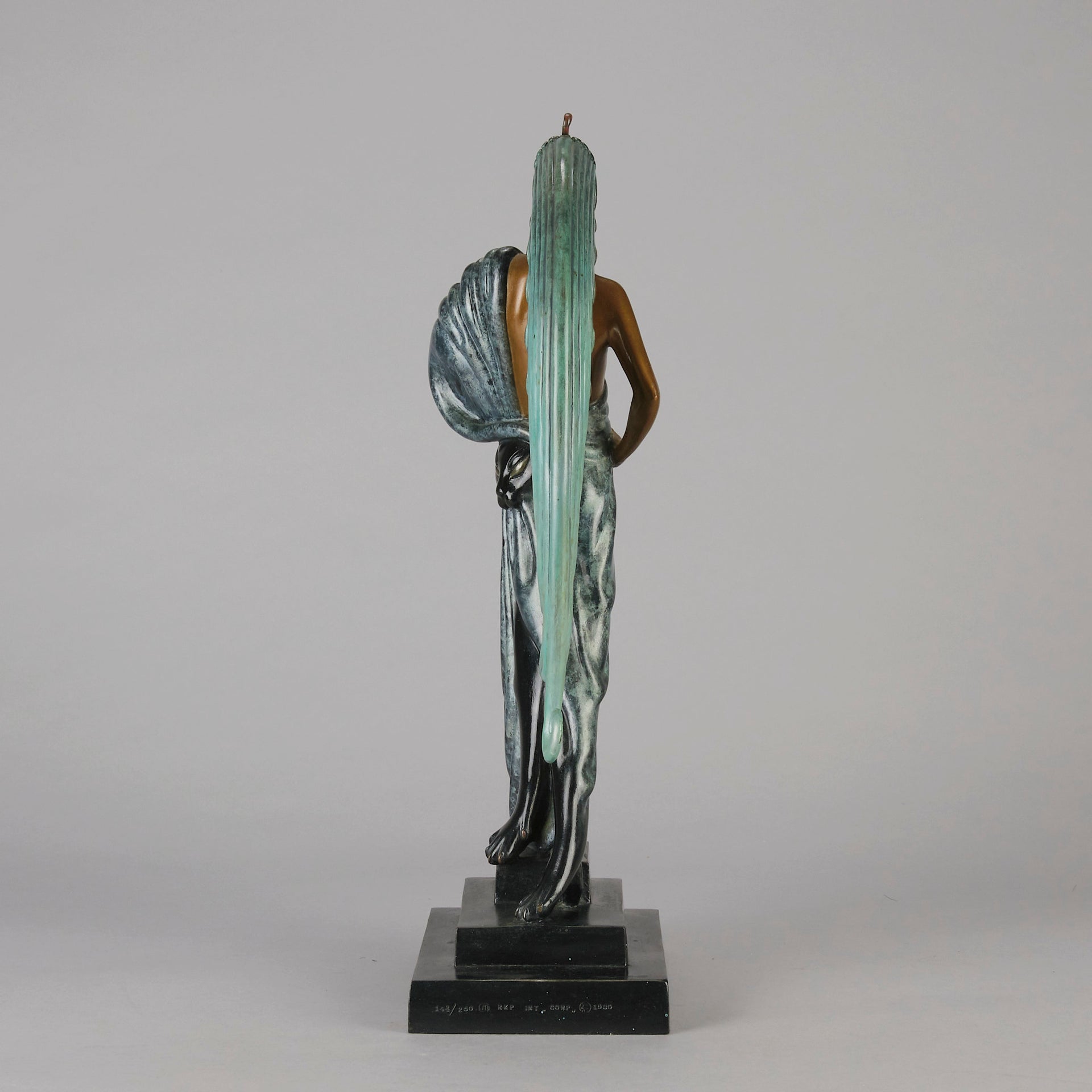  Beauty and the Beast by Erté a limited edition 20th Century bronze figure modelled as a beautiful young woman walking up a set of stairs wearing an impressive headdress and draped in a panther fur 