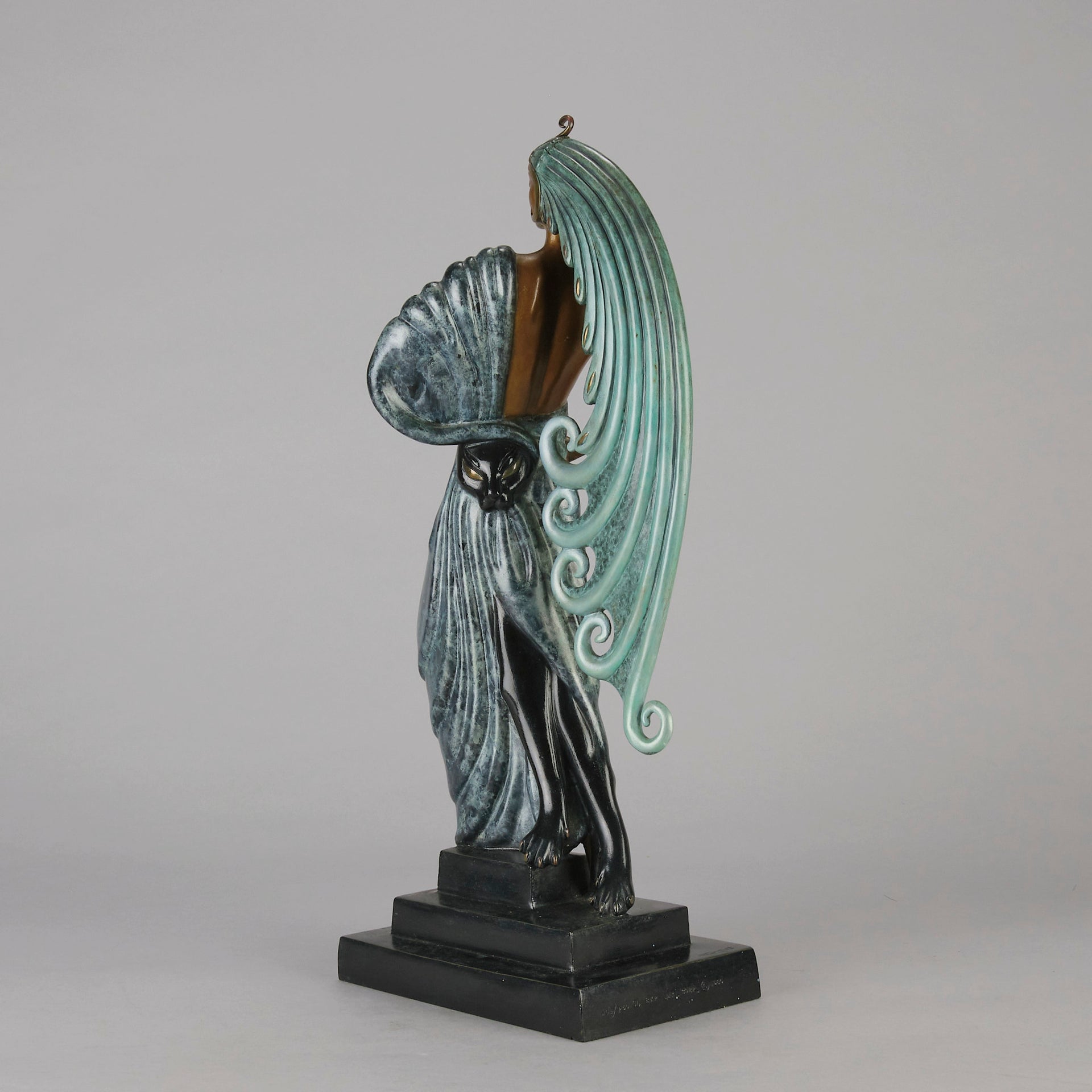  Beauty and the Beast by Erté a limited edition 20th Century bronze figure modelled as a beautiful young woman walking up a set of stairs wearing an impressive headdress and draped in a panther fur 