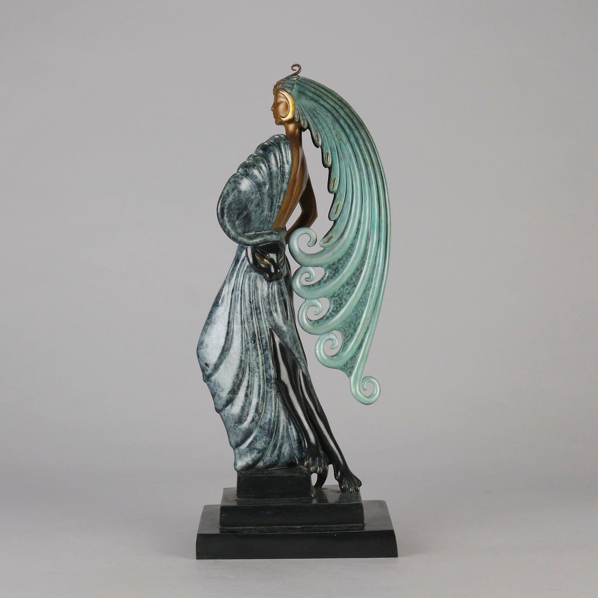  Beauty and the Beast by Erté a limited edition 20th Century bronze figure modelled as a beautiful young woman walking up a set of stairs wearing an impressive headdress and draped in a panther fur 