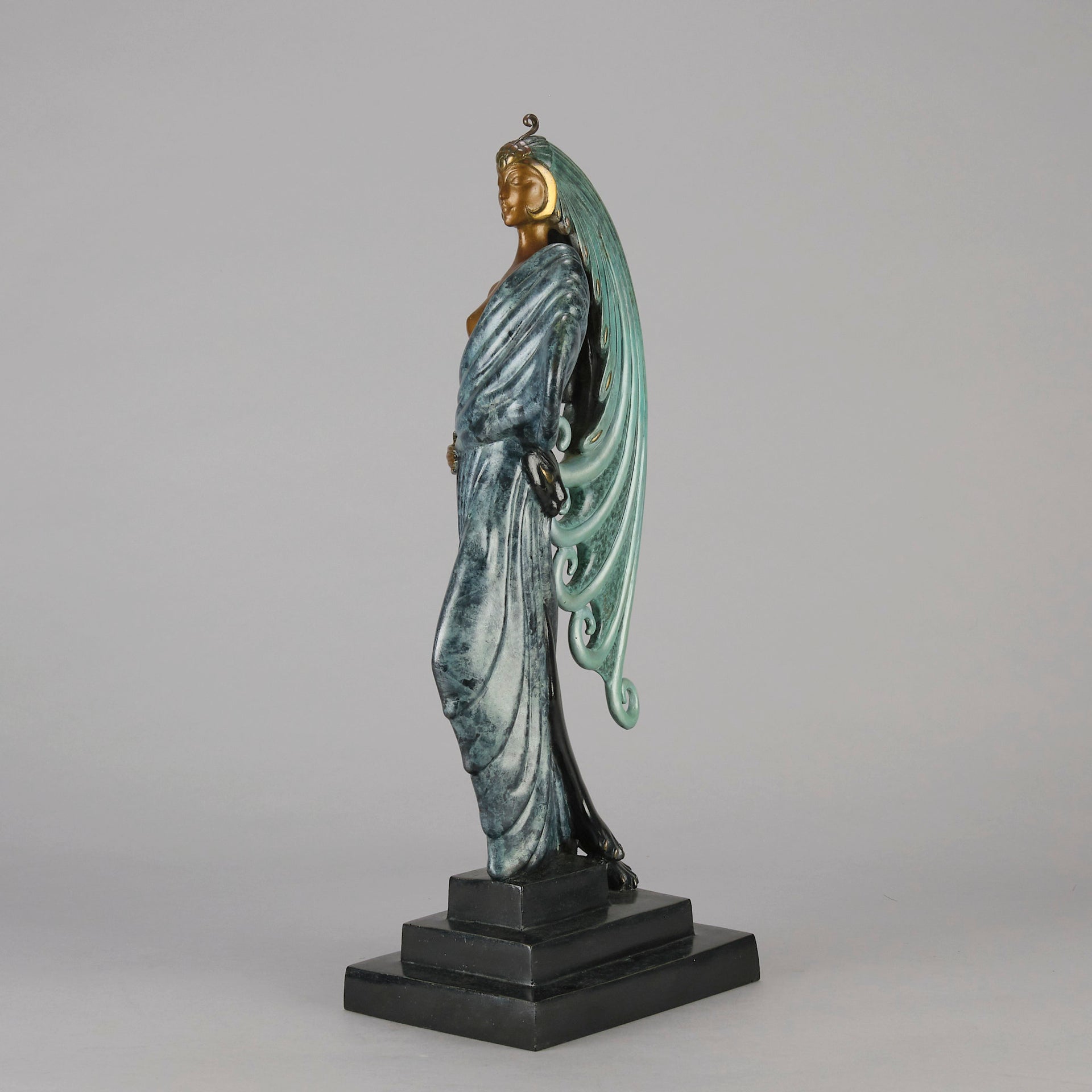  Beauty and the Beast by Erté a limited edition 20th Century bronze figure modelled as a beautiful young woman walking up a set of stairs wearing an impressive headdress and draped in a panther fur 