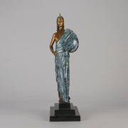  Beauty and the Beast by Erté a limited edition 20th Century bronze figure modelled as a beautiful young woman walking up a set of stairs wearing an impressive headdress and draped in a panther fur 