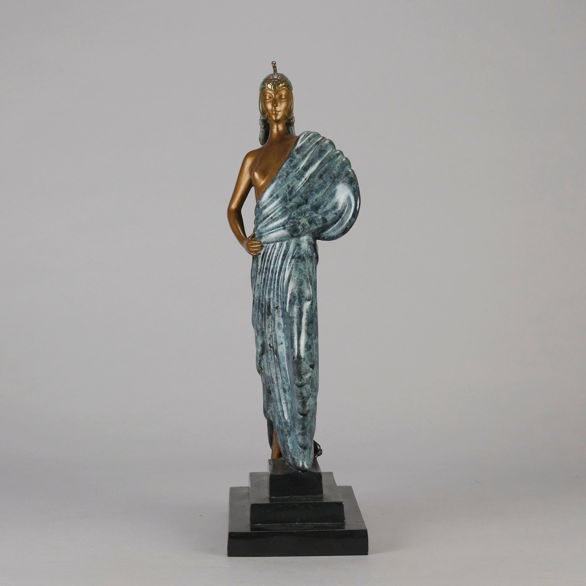  Beauty and the Beast by Erté a limited edition 20th Century bronze figure modelled as a beautiful young woman walking up a set of stairs wearing an impressive headdress and draped in a panther fur 