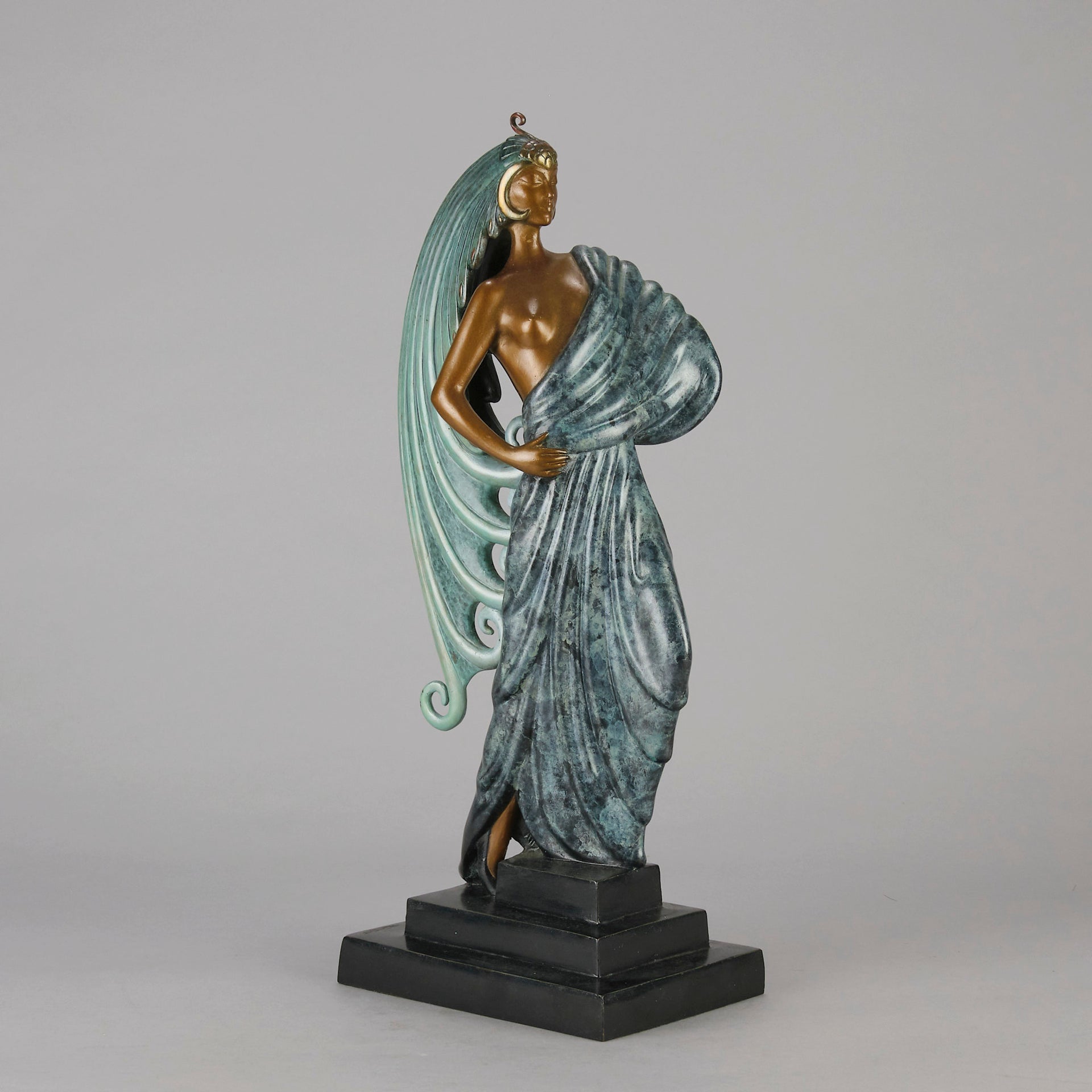  Beauty and the Beast by Erté a limited edition 20th Century bronze figure modelled as a beautiful young woman walking up a set of stairs wearing an impressive headdress and draped in a panther fur 