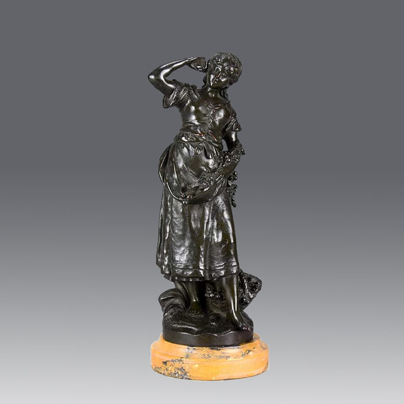 Summer by Auguste Moreau an antique bronze figure of a young girl in period clothing carrying an arm full of fruits with a basket full by her side, with excellent surface detail 