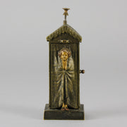 Bathing Belle by Franz Bergman an amusingly erotic early 20th Century Austrian bronze figure of a young beauty in a seaside hut peeking out between the curtains. The mechanism pushes down to turn the front curtain around revealing 'what the butler saw' as her naked body is revealed from behind