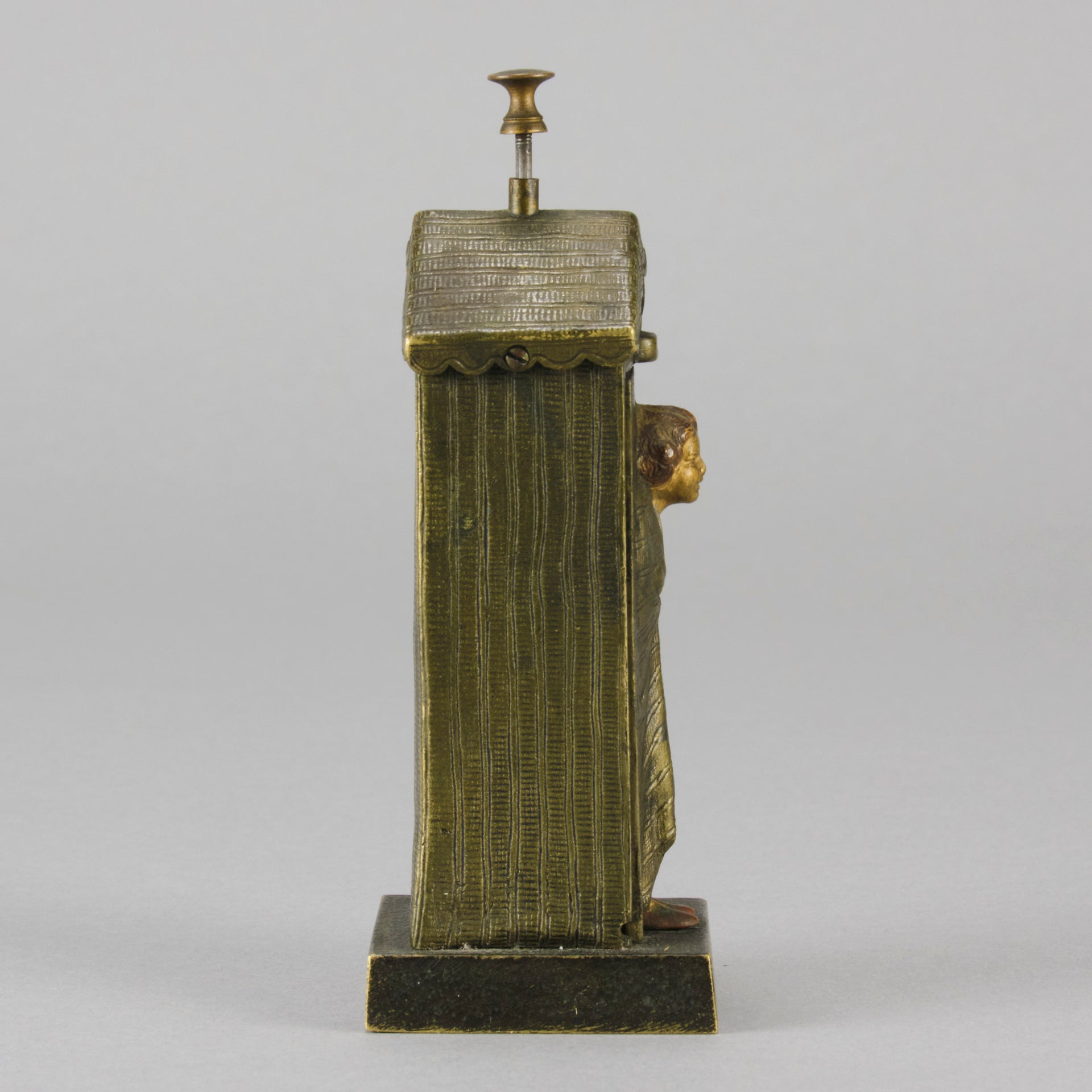 Bathing Belle by Franz Bergman an amusingly erotic early 20th Century Austrian bronze figure of a young beauty in a seaside hut peeking out between the curtains. The mechanism pushes down to turn the front curtain around revealing 'what the butler saw' as her naked body is revealed from behind