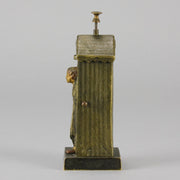 Bathing Belle by Franz Bergman an amusingly erotic early 20th Century Austrian bronze figure of a young beauty in a seaside hut peeking out between the curtains. The mechanism pushes down to turn the front curtain around revealing 'what the butler saw' as her naked body is revealed from behind