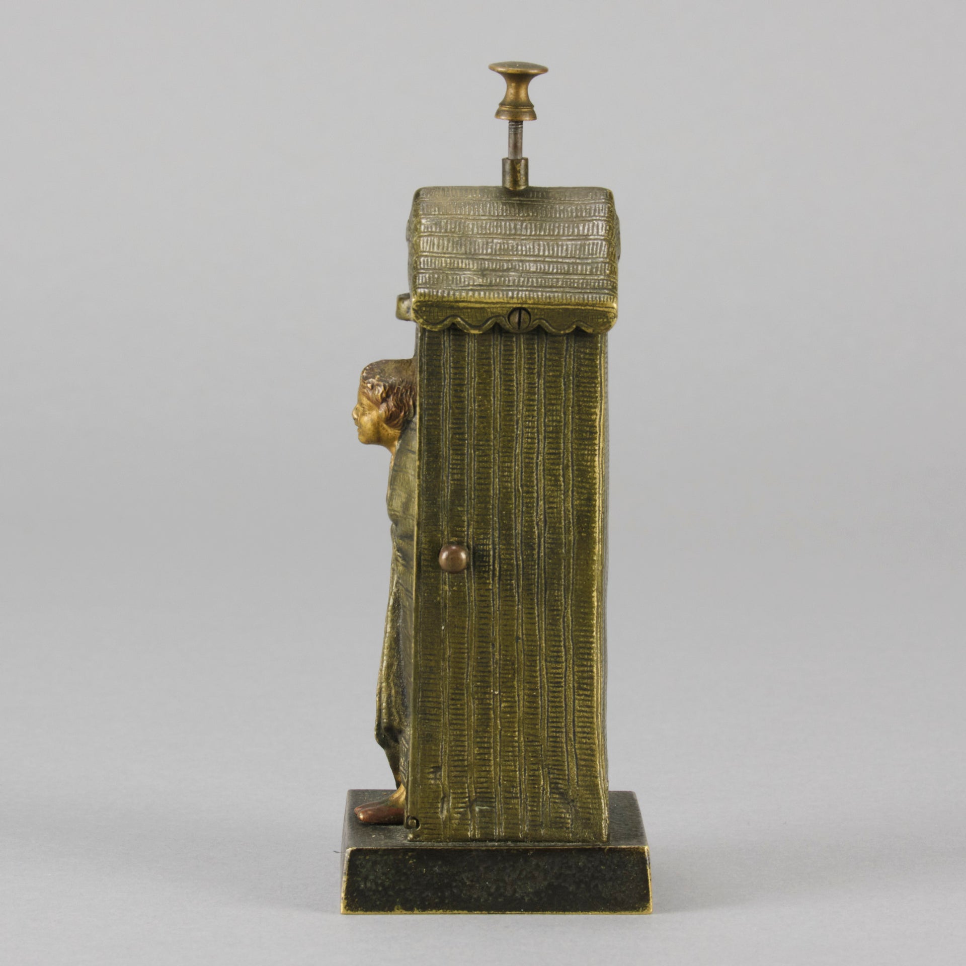 Bathing Belle by Franz Bergman an amusingly erotic early 20th Century Austrian bronze figure of a young beauty in a seaside hut peeking out between the curtains. The mechanism pushes down to turn the front curtain around revealing 'what the butler saw' as her naked body is revealed from behind