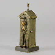 Bathing Belle by Franz Bergman an amusingly erotic early 20th Century Austrian bronze figure of a young beauty in a seaside hut peeking out between the curtains. The mechanism pushes down to turn the front curtain around revealing 'what the butler saw' as her naked body is revealed from behind