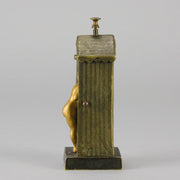 Bathing Belle by Franz Bergman an amusingly erotic early 20th Century Austrian bronze figure of a young beauty in a seaside hut peeking out between the curtains. The mechanism pushes down to turn the front curtain around revealing 'what the butler saw' as her naked body is revealed from behind