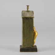 Bathing Belle by Franz Bergman an amusingly erotic early 20th Century Austrian bronze figure of a young beauty in a seaside hut peeking out between the curtains. The mechanism pushes down to turn the front curtain around revealing 'what the butler saw' as her naked body is revealed from behind