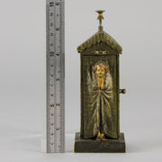 Bathing Belle by Franz Bergman an amusingly erotic early 20th Century Austrian bronze figure of a young beauty in a seaside hut peeking out between the curtains. The mechanism pushes down to turn the front curtain around revealing 'what the butler saw' as her naked body is revealed from behind