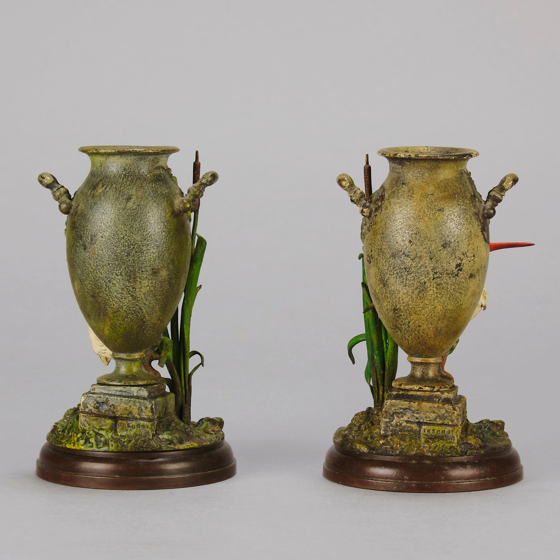 A Pair of Bird Vases by Franz Bergman decorated with Ibis standing amongst bulrush raised on a naturalistic bases with very fine colours and good hand finished surface detail 