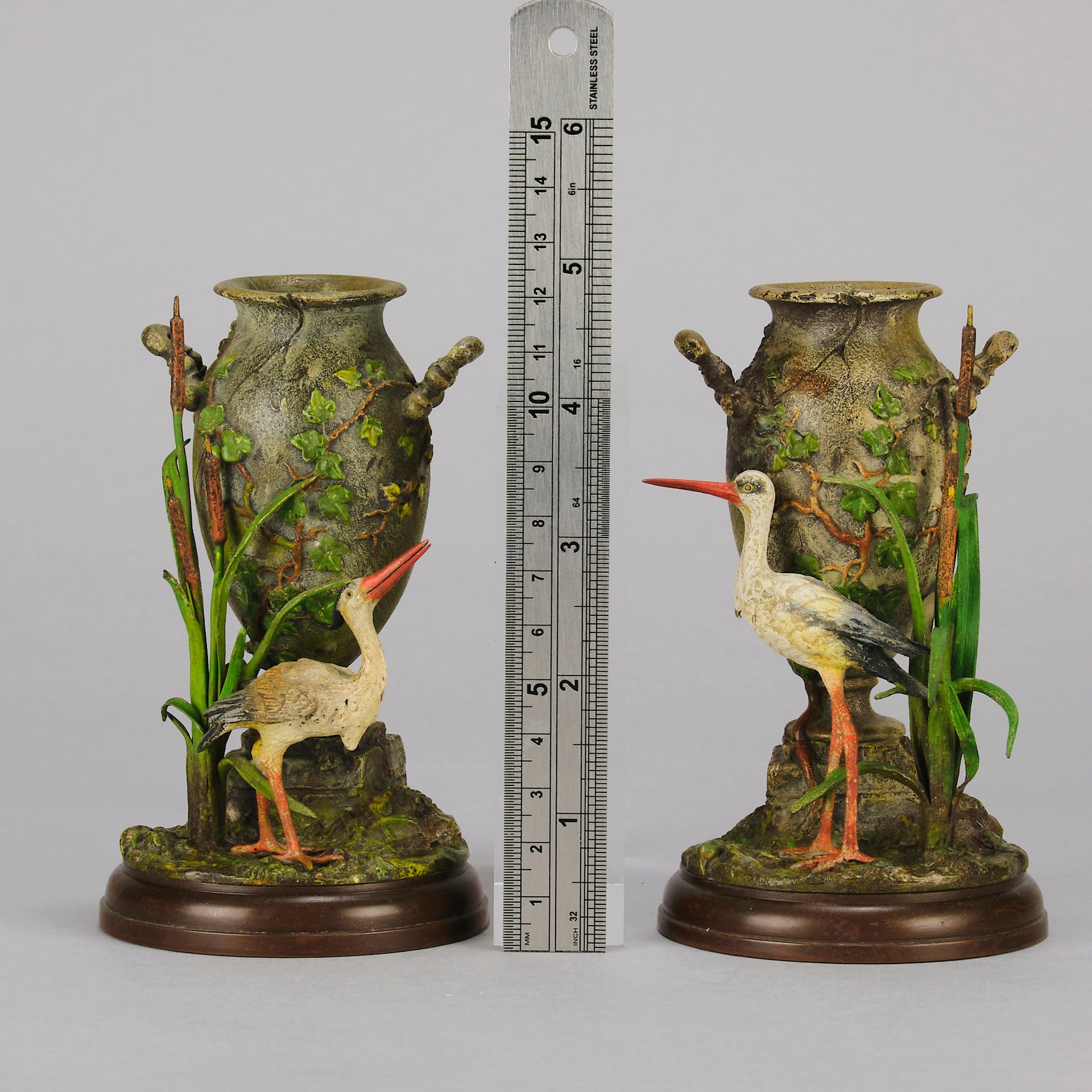 A Pair of Bird Vases by Franz Bergman decorated with Ibis standing amongst bulrush raised on a naturalistic bases with very fine colours and good hand finished surface detail 