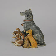 Group of 8 seated dogs of various breeds in cold painted bronze by Franz Bergman with excellent naturalistic colour and fine hand chased surface detail