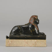 Erotic Sphinx by Franz Bergman a charming and erotic late 19th Century Austrian cold painted bronze figure of a recumbent sphinx, hinged and opening to reveal a naked beauty seated on a rug with gilt and enamel colour
