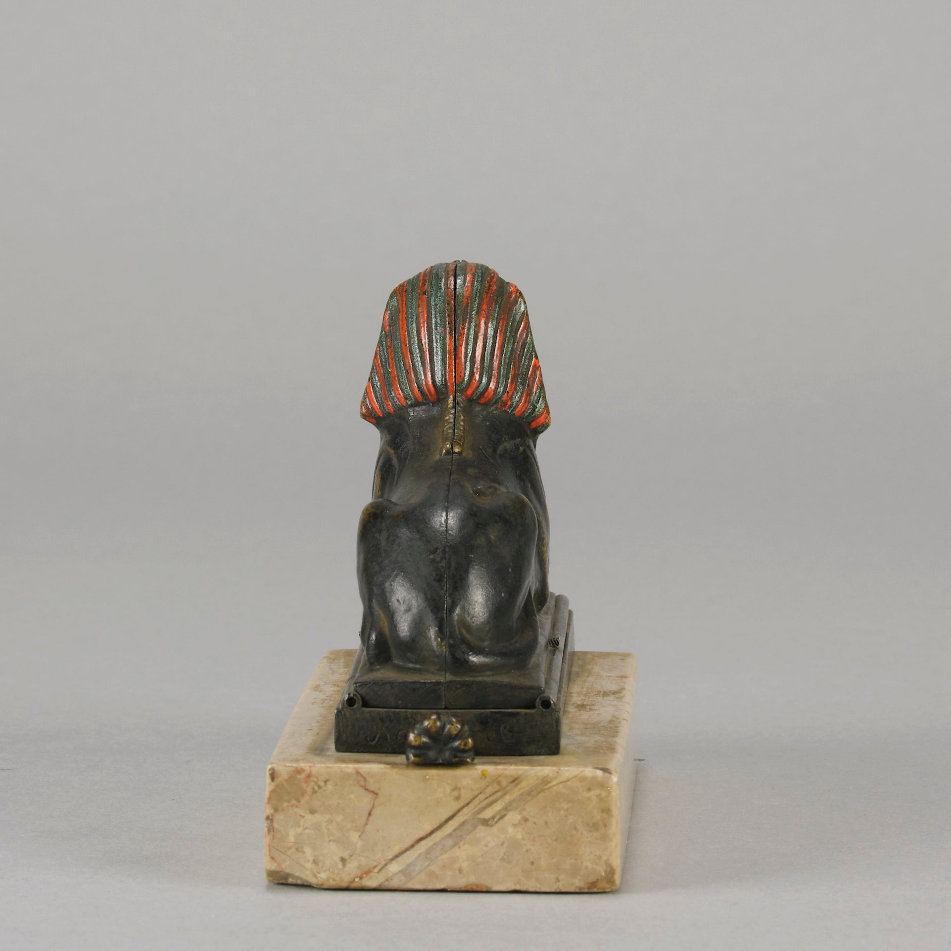 Erotic Sphinx by Franz Bergman a charming and erotic late 19th Century Austrian cold painted bronze figure of a recumbent sphinx, hinged and opening to reveal a naked beauty seated on a rug with gilt and enamel colour