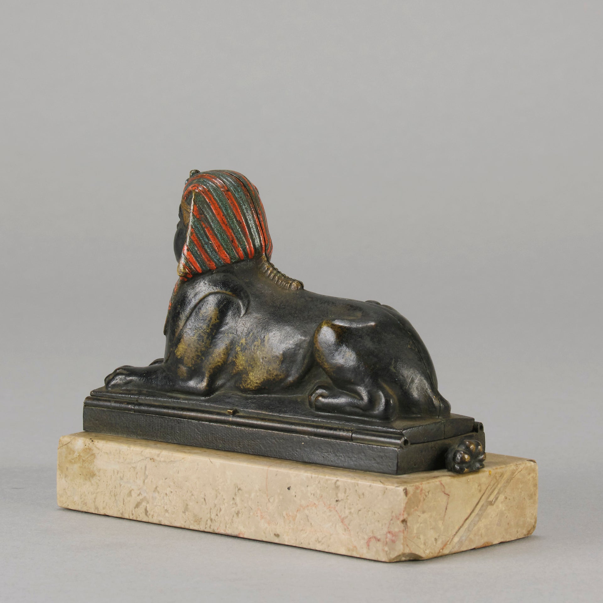 Erotic Sphinx by Franz Bergman a charming and erotic late 19th Century Austrian cold painted bronze figure of a recumbent sphinx, hinged and opening to reveal a naked beauty seated on a rug with gilt and enamel colour