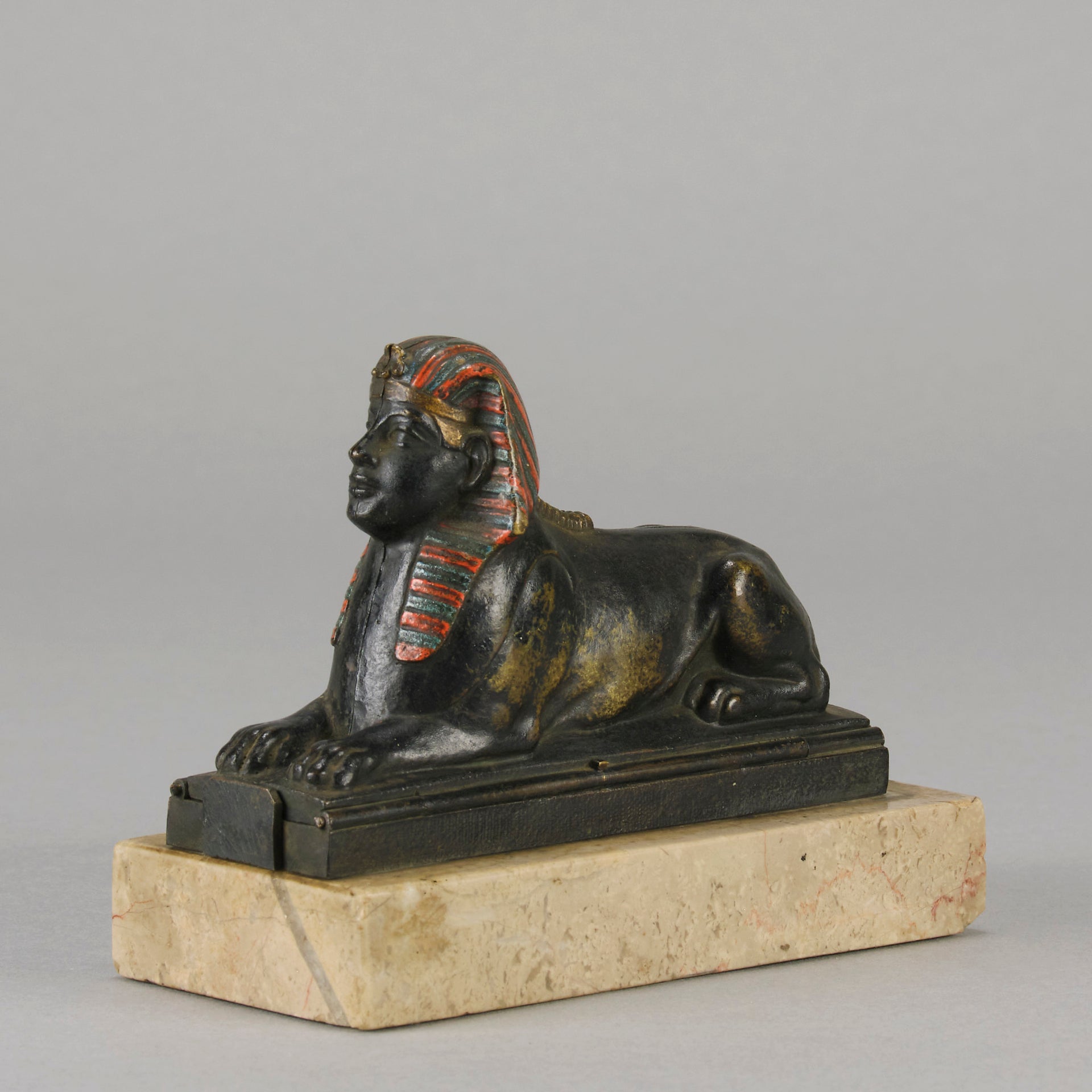 Erotic Sphinx by Franz Bergman a charming and erotic late 19th Century Austrian cold painted bronze figure of a recumbent sphinx, hinged and opening to reveal a naked beauty seated on a rug with gilt and enamel colour