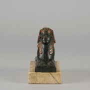 Erotic Sphinx by Franz Bergman a charming and erotic late 19th Century Austrian cold painted bronze figure of a recumbent sphinx, hinged and opening to reveal a naked beauty seated on a rug with gilt and enamel colour