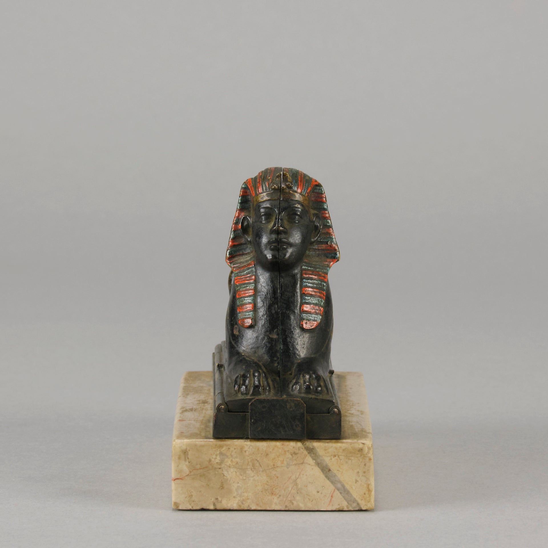 Erotic Sphinx by Franz Bergman a charming and erotic late 19th Century Austrian cold painted bronze figure of a recumbent sphinx, hinged and opening to reveal a naked beauty seated on a rug with gilt and enamel colour