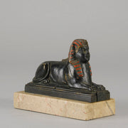 Erotic Sphinx by Franz Bergman a charming and erotic late 19th Century Austrian cold painted bronze figure of a recumbent sphinx, hinged and opening to reveal a naked beauty seated on a rug with gilt and enamel colour