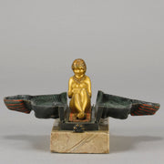 Erotic Sphinx by Franz Bergman a charming and erotic late 19th Century Austrian cold painted bronze figure of a recumbent sphinx, hinged and opening to reveal a naked beauty seated on a rug with gilt and enamel colour