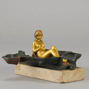 Erotic Sphinx by Franz Bergman a charming and erotic late 19th Century Austrian cold painted bronze figure of a recumbent sphinx, hinged and opening to reveal a naked beauty seated on a rug with gilt and enamel colour