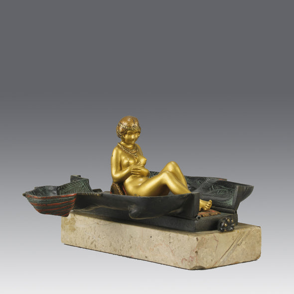 Erotic Sphinx by Franz Bergman a charming and erotic late 19th Century Austrian cold painted bronze figure of a recumbent sphinx, hinged and opening to reveal a naked beauty seated on a rug with gilt and enamel colour