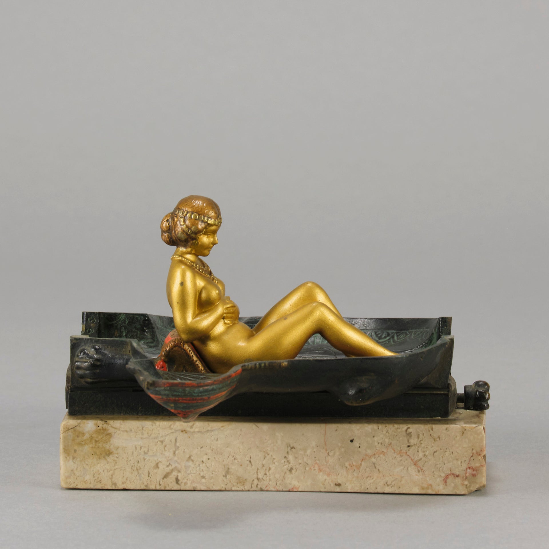 Erotic Sphinx by Franz Bergman a charming and erotic late 19th Century Austrian cold painted bronze figure of a recumbent sphinx, hinged and opening to reveal a naked beauty seated on a rug with gilt and enamel colour