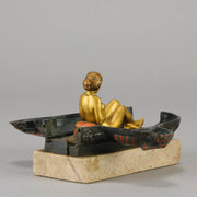 Erotic Sphinx by Franz Bergman a charming and erotic late 19th Century Austrian cold painted bronze figure of a recumbent sphinx, hinged and opening to reveal a naked beauty seated on a rug with gilt and enamel colour