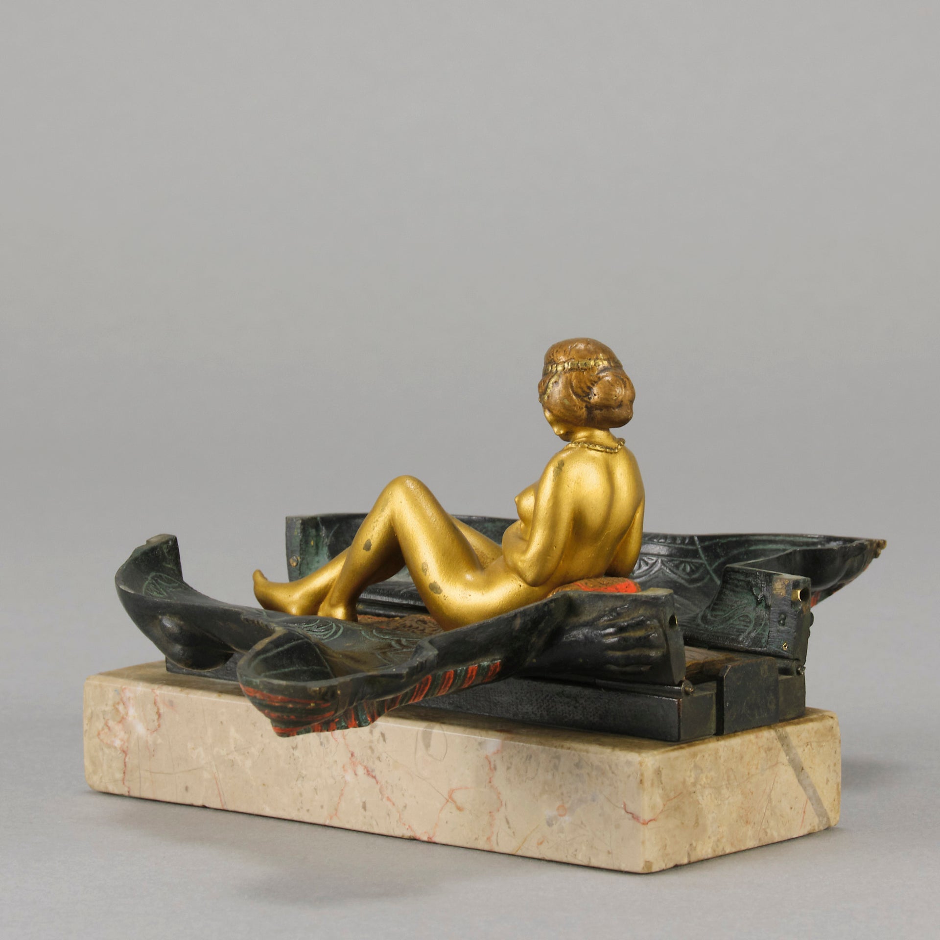 Erotic Sphinx by Franz Bergman a charming and erotic late 19th Century Austrian cold painted bronze figure of a recumbent sphinx, hinged and opening to reveal a naked beauty seated on a rug with gilt and enamel colour