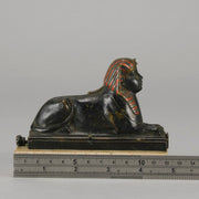 Erotic Sphinx by Franz Bergman a charming and erotic late 19th Century Austrian cold painted bronze figure of a recumbent sphinx, hinged and opening to reveal a naked beauty seated on a rug with gilt and enamel colour