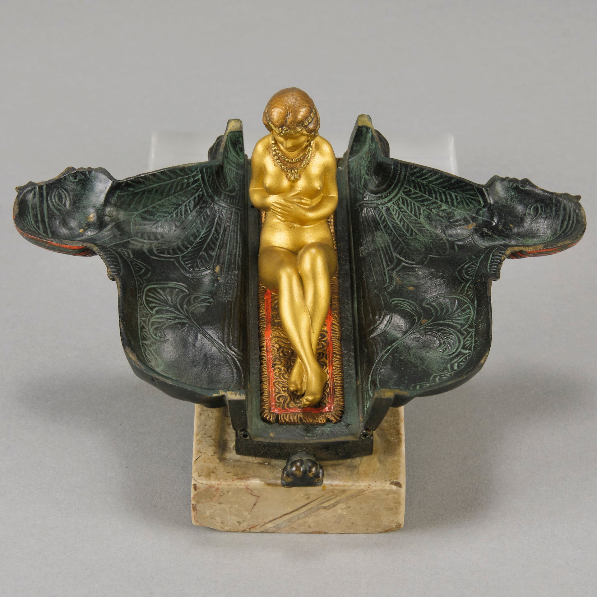 Erotic Sphinx by Franz Bergman a charming and erotic late 19th Century Austrian cold painted bronze figure of a recumbent sphinx, hinged and opening to reveal a naked beauty seated on a rug with gilt and enamel colour