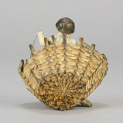 Girl & Cat with Basket - Bergman Bronze - A charming early 20th Century Austrian bronze group study of a young child and cat standing in a wicker basket playing with a ball of string - Hickmet Fine Arts