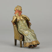 Lady Reading by Franz Bergman an attractive early 20th Century Austrian bronze study of a seated lady wearing a loosley fitted night dress reading a book, her dress lifting to reveal her beautiful body