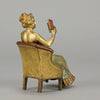 Lady Reading by Franz Bergman an attractive early 20th Century Austrian bronze study of a seated lady wearing a loosley fitted night dress reading a book, her dress lifting to reveal her beautiful body
