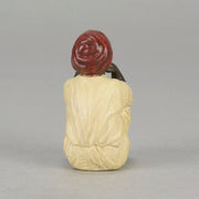 Seated Boy by Franz Bergman an early 20th Century cold painted Austrian bronze figure of a young Arab boy dressed in full period orientalist attire seated with his head resting upon his hands in deep thought