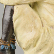 Seated Boy by Franz Bergman an early 20th Century cold painted Austrian bronze figure of a young Arab boy dressed in full period orientalist attire seated with his head resting upon his hands in deep thought