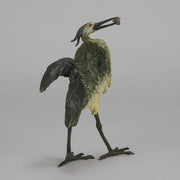 A Standing Stork with Fish Antique Bronze Statue by Franz Bergman exhibiting very fine cold painted colours and good hand finished surface detail
