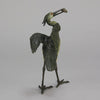 A Standing Stork with Fish Antique Bronze Statue by Franz Bergman exhibiting very fine cold painted colours and good hand finished surface detail