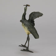A Standing Stork with Fish Antique Bronze Statue by Franz Bergman exhibiting very fine cold painted colours and good hand finished surface detail