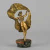 Windy Day by Franz Bergman a sensuous early 20th century erotic Austrian bronze figurine of a beautiful dancer dressed in an Oriental outfit, the skirt hinged to lift and reveal her naked bod