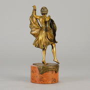 Windy Day by Franz Bergman a sensuous early 20th century erotic Austrian bronze figurine of a young dancer with fine cold painted colour and good detail, the skirt hinged to lift and reveal her naked body