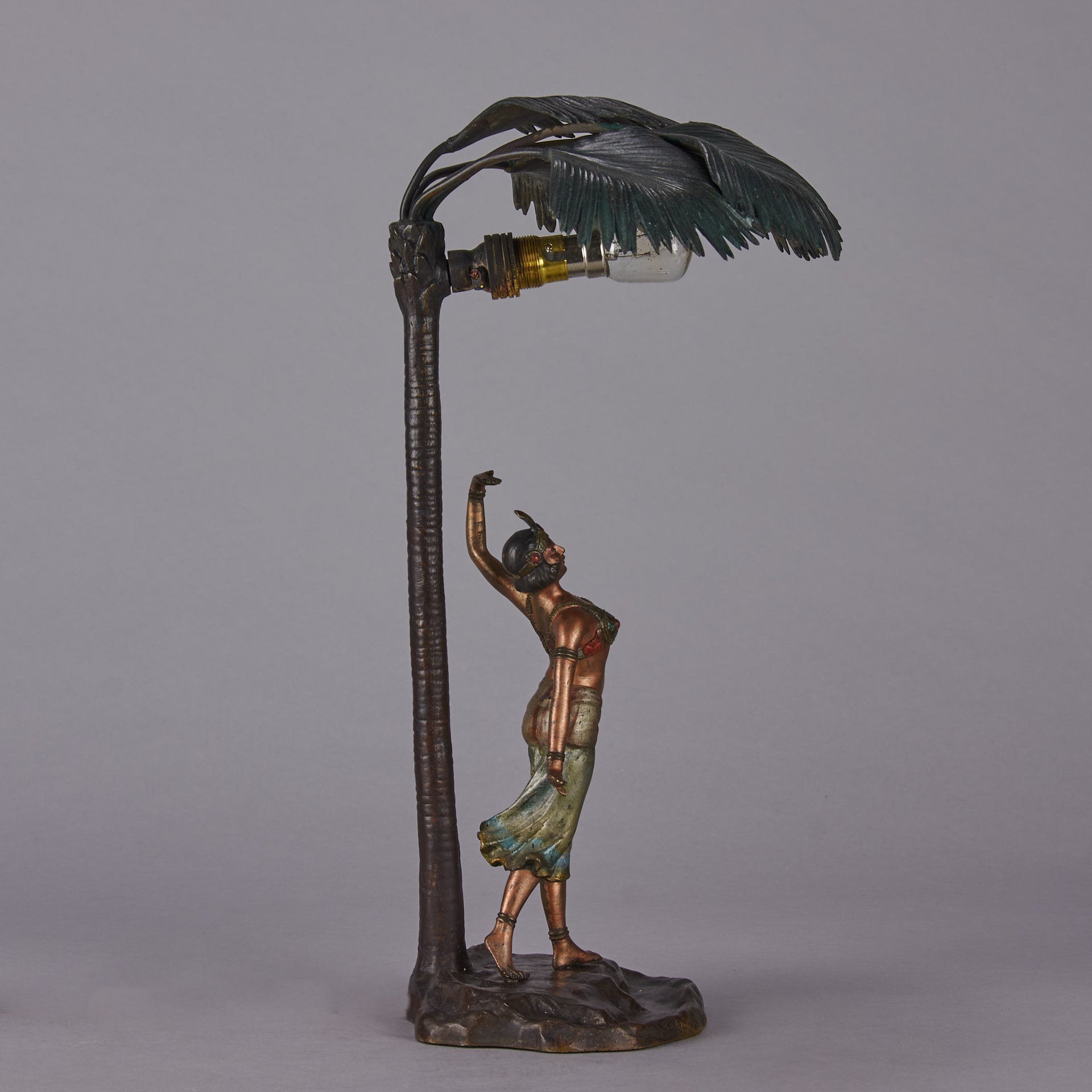 Woman Under Palm Tree Lamp by Franz Bergman Very fine early 20th Century Vienna bronze table lamp modelled as an Orientalist dancer by the side of a palm tree fitted with a light under its palms