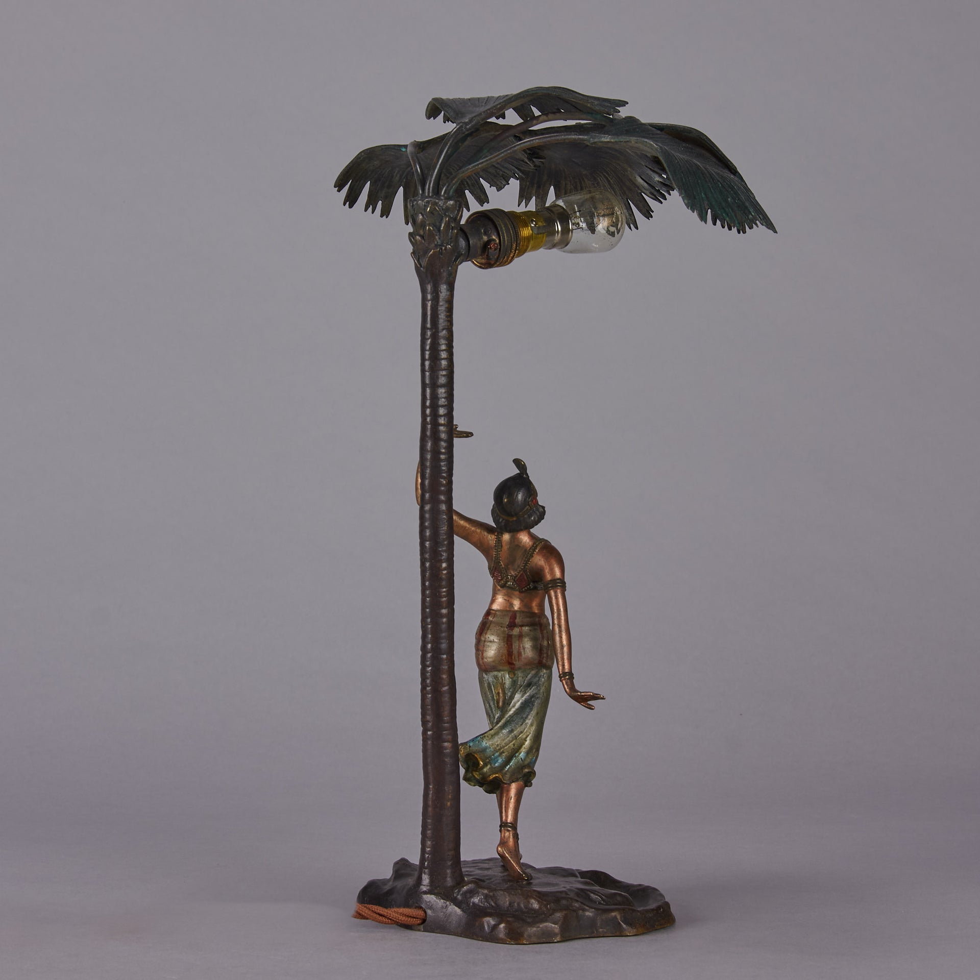 Woman Under Palm Tree Lamp by Franz Bergman Very fine early 20th Century Vienna bronze table lamp modelled as an Orientalist dancer by the side of a palm tree fitted with a light under its palms