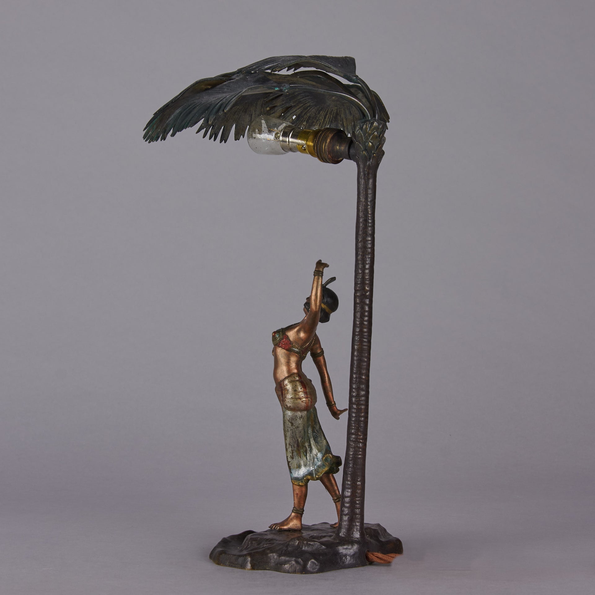 Woman Under Palm Tree Lamp by Franz Bergman Very fine early 20th Century Vienna bronze table lamp modelled as an Orientalist dancer by the side of a palm tree fitted with a light under its palms